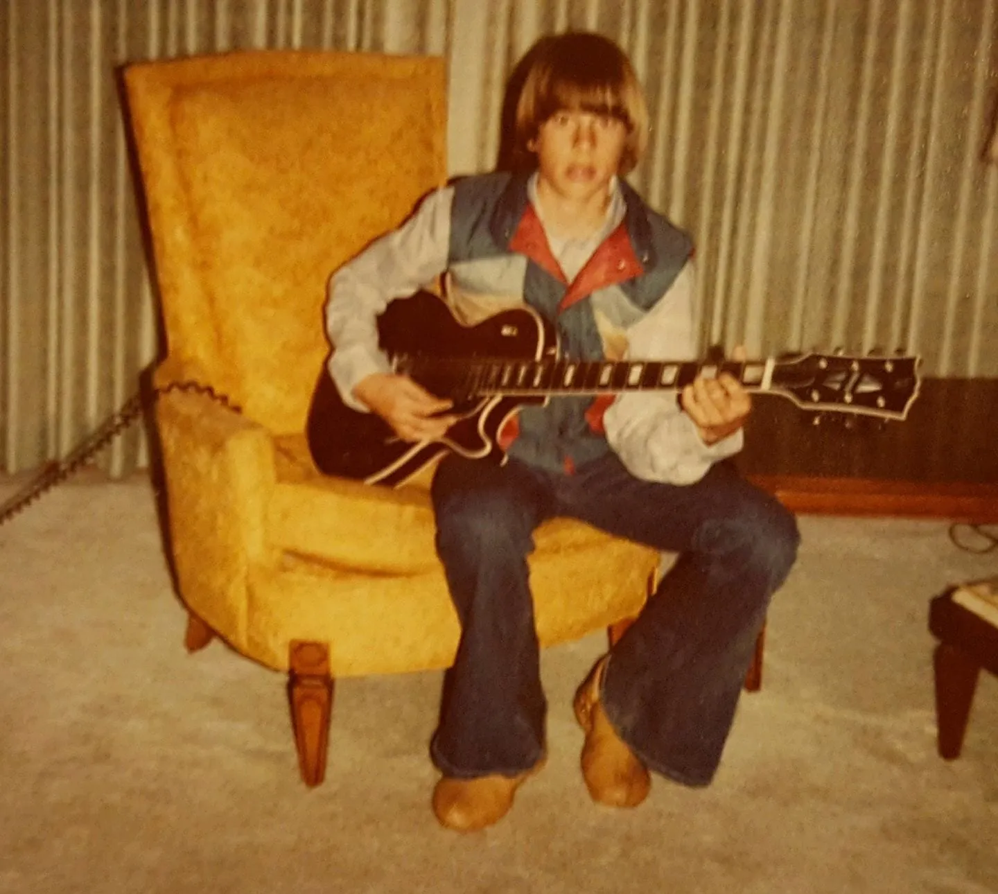 First guitar in the gold chair